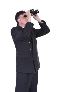 Businessman looking through binoculars clipart