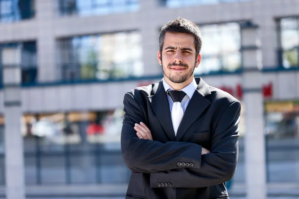 Businessman in front of an office — Stock Photo, Image