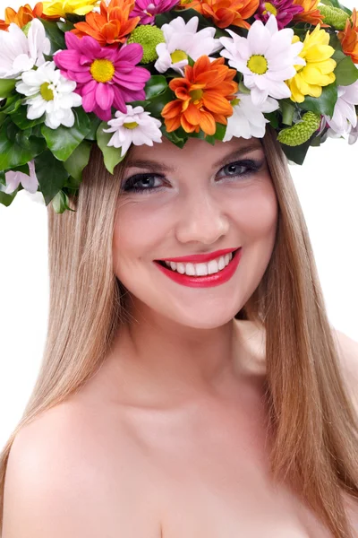 Beautiful young girl with flowers — Stock Photo, Image