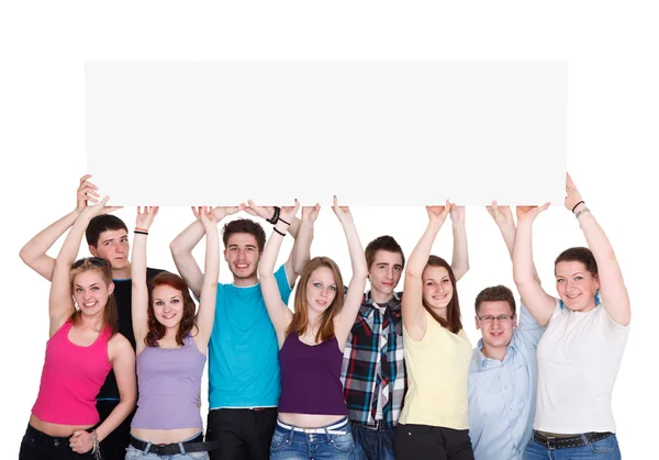 Gruppo di nove giovani sorridenti con banner in bianco — Foto Stock
