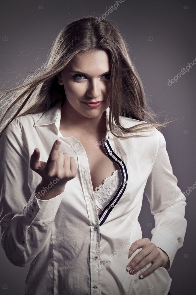 Sexy woman in unbuttoned shirt.