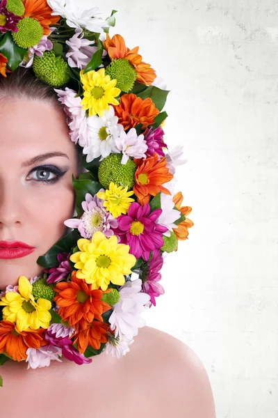 Make-up woman’s face with border of flowers — Stock Photo, Image