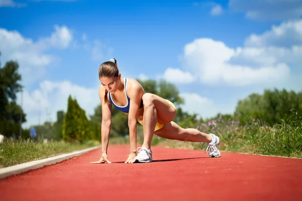 Female runner stretching — Stock Photo, Image