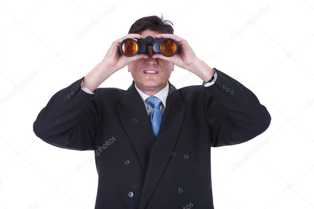 Businessman with binoculars looking to the future