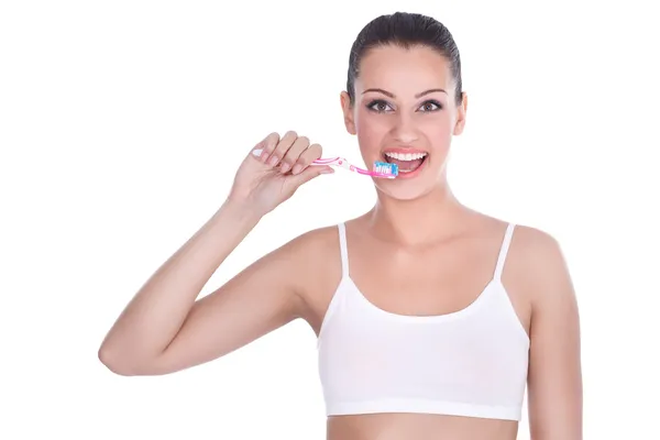 Счастливая женщина с зубной щеткой — стоковое фото