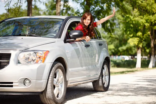 Happy woman in car — Stock Photo, Image