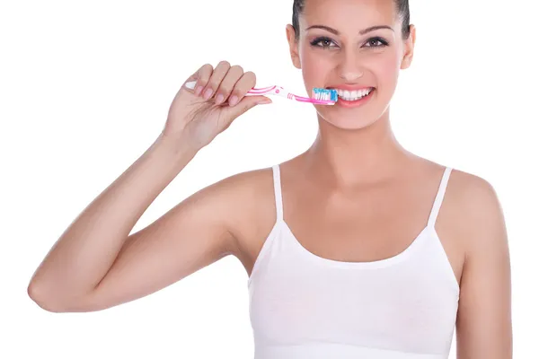 Mujer cepillándose los dientes —  Fotos de Stock