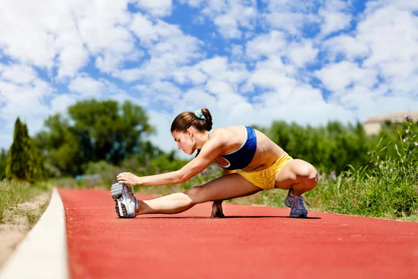 Athlete female stretching — Stock Photo, Image
