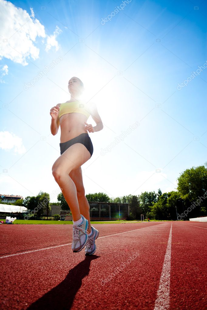 Woman running on sunny day