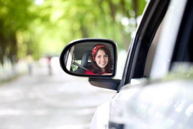 Smiling woman driving clipart