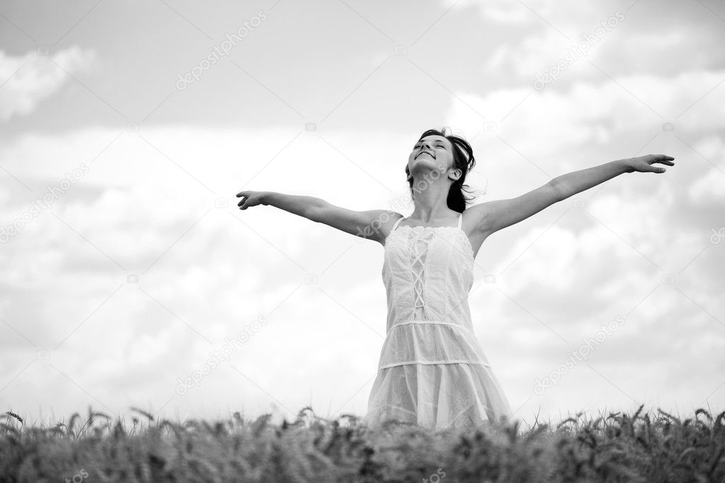 Woman in wheat field, black and white