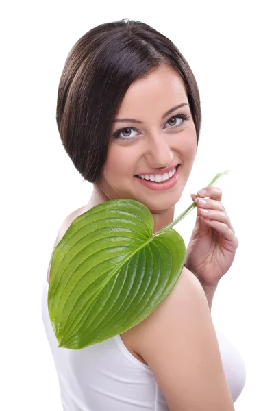 Женщина с зеленым листом — стоковое фото