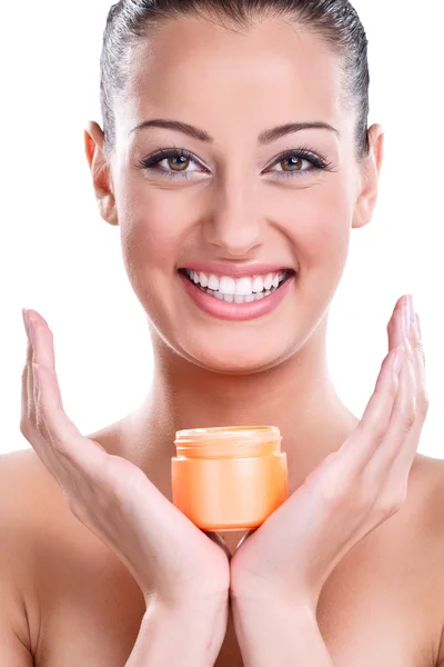 Beautiful smiling young woman with cream — Stock Photo, Image