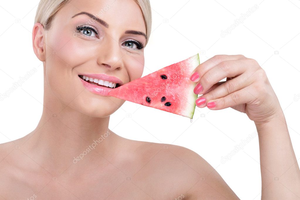 Smiling woman with piece of watermelon