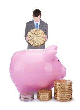 Young businessman with pigggy bank clipart