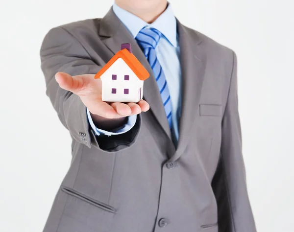 Businessman with a house — Stock Photo, Image