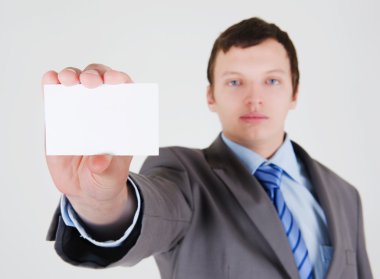 Young businessman with a business card clipart