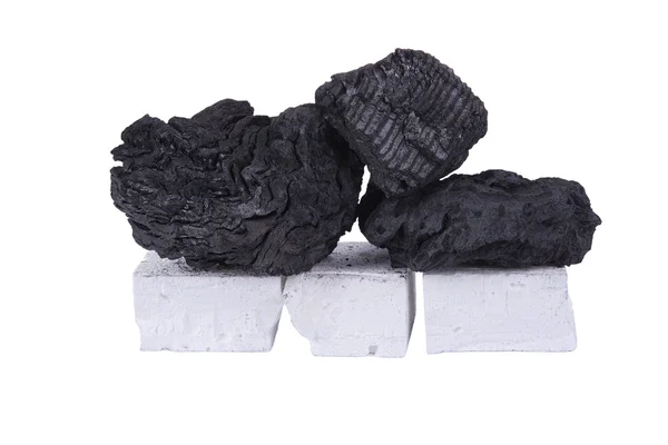 Svart kol och vit firelighter — Stockfoto