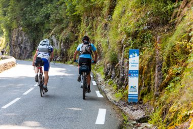 Amatuer Cyclists Climbing Col d'Aubisque clipart