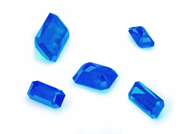 白い背景の上の 5 つの青いサファイア — ストック写真