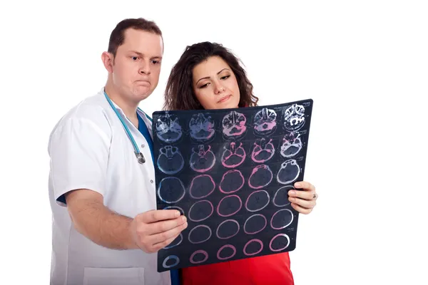 Confused doctors looking at computed tomography (CT) — Stock Photo, Image