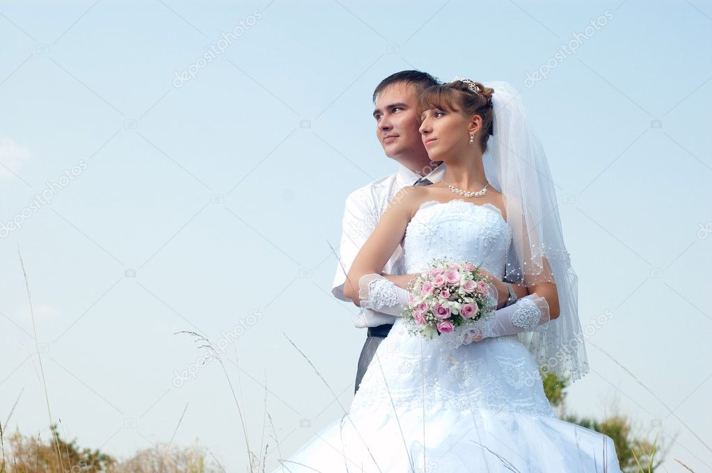 Happy bride and groom outdoors