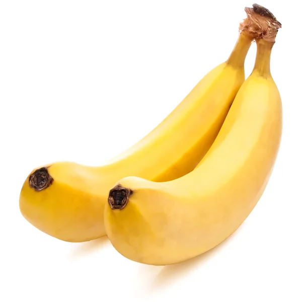 Dvě žluté banány zralé izolované nachází kaskády na bílém pozadí — Stock fotografie