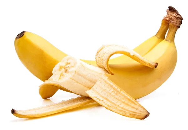 Ukousnutý žluté banány zralé izolované nachází kaskády na bílém pozadí — Stock fotografie