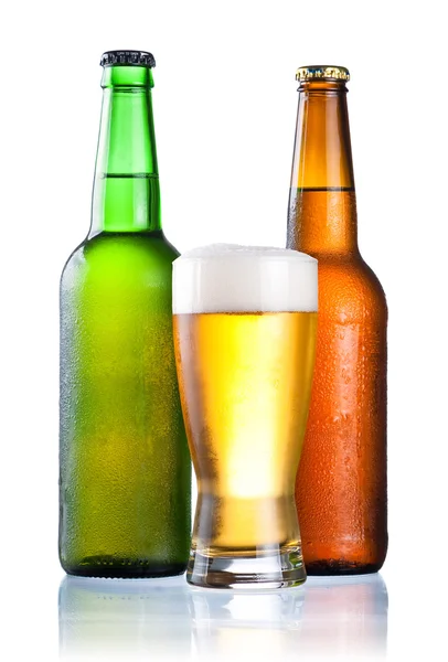 Brown and green bottles full of condensate and covered with a gl — Stock Photo, Image
