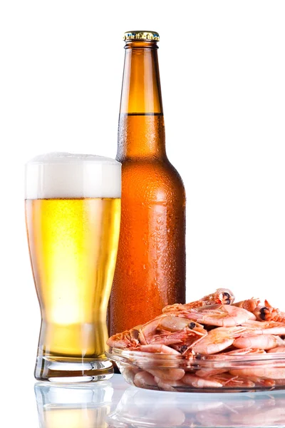Brown bottle of beer with a condensate, glass and plate of boile — Stock Photo, Image