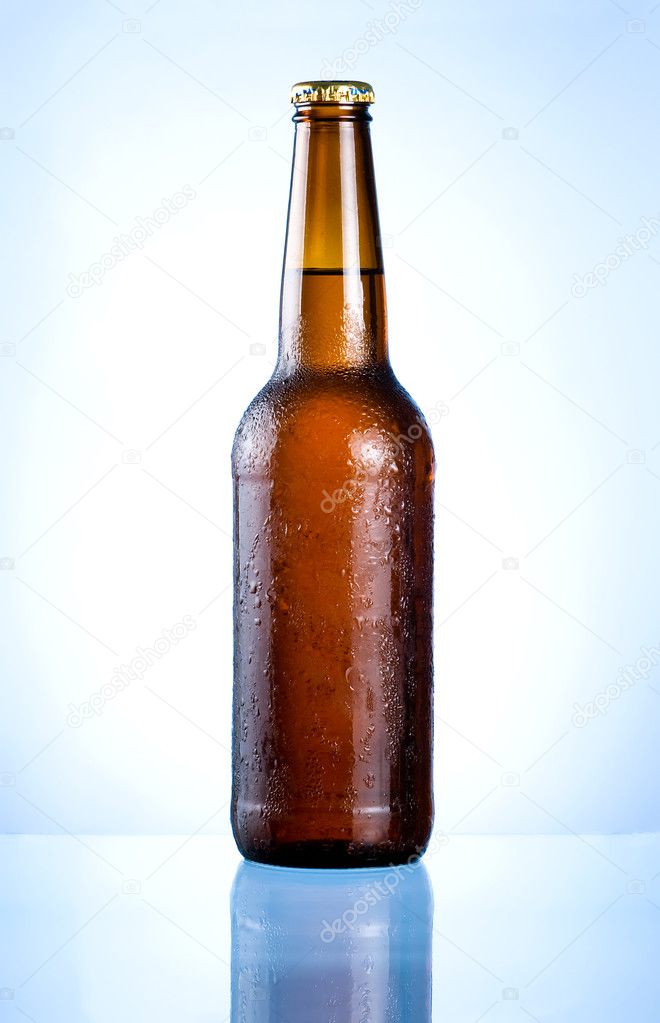 Full brown bottle with condensation on a blue background