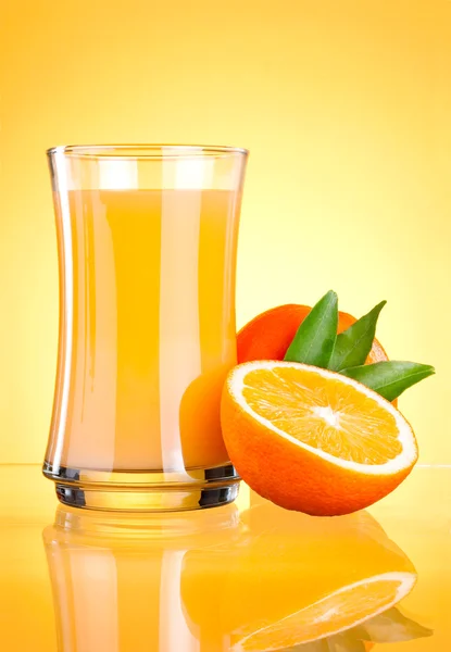 Glass of Fresh Orange juice on yellow background — Stock Photo, Image