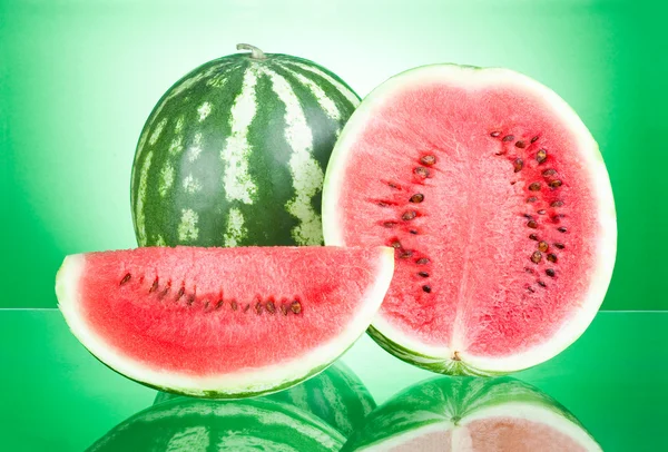 Watermelon, half and Slice on a green background — Stock Photo, Image