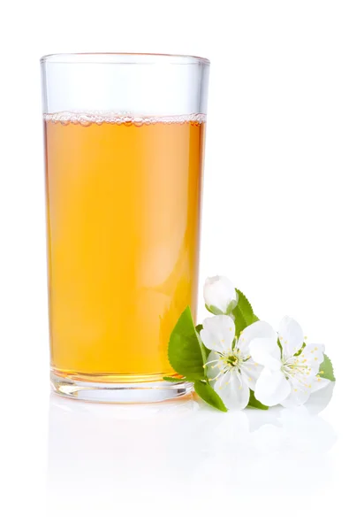 stock image Glass of apple juice and flowers isolated on white background