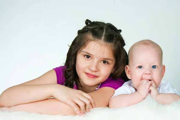 Elder sister and little brother — Stock Photo, Image