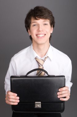 Young businessman with brief case