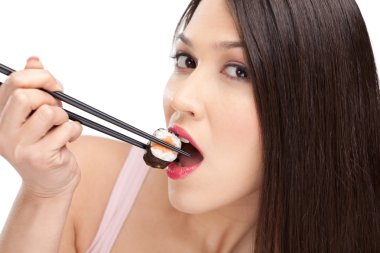 Black-haired woman holding sushi with a chopsticks clipart