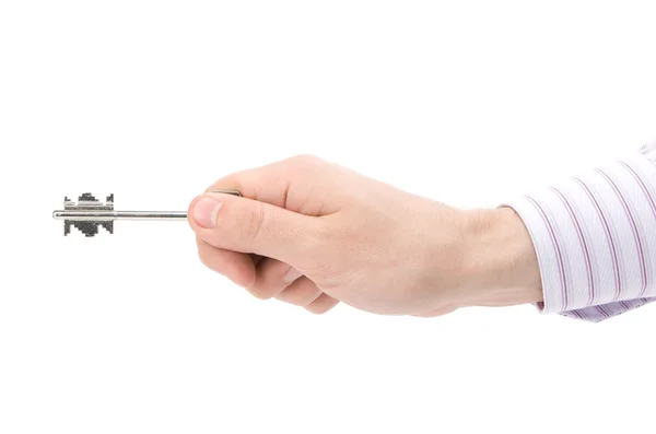 Mão do empresário segurando a chave — Fotografia de Stock