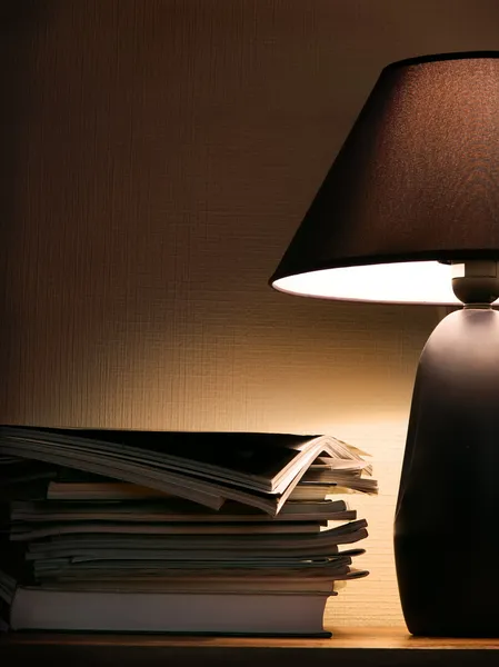 Stock image Magazines under evening lamp light