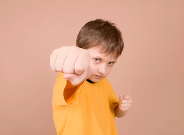 Young boy showing off his fist — Stock Photo, Image