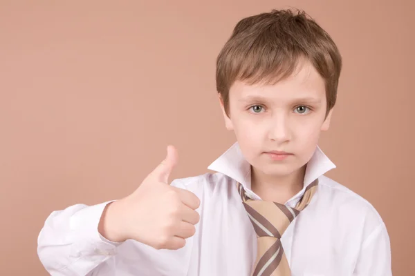 Young businessman giving a thumbs up — Stock Photo, Image