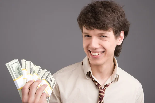 Молодой бизнесмен с деньгами — стоковое фото