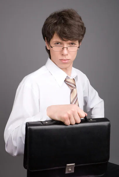 Young businessman with brief case — Stok fotoğraf
