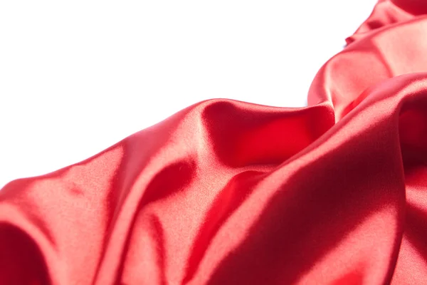 Красная шелковая ткань поверх белой — стоковое фото