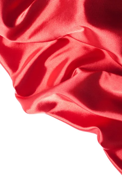 Красная шелковая ткань на белом фоне — стоковое фото