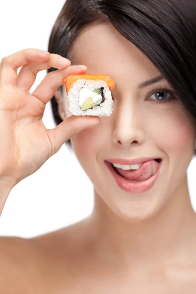Chica joven sosteniendo sushi — Foto de Stock