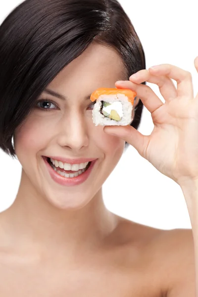 Young girl holding sushi and smiling — Stock Photo, Image