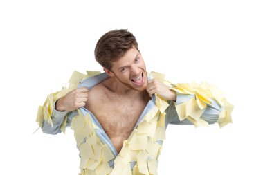 A young male ripping off his shirt, covered with stickers clipart