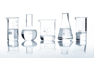 Five laboratory flasks with a clear liquid clipart