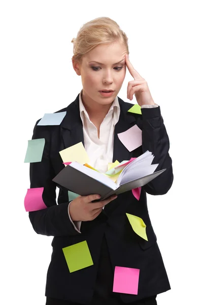 Attraktive Geschäftsfrau mit Tagebuch auf weißem Hintergrund — Stockfoto